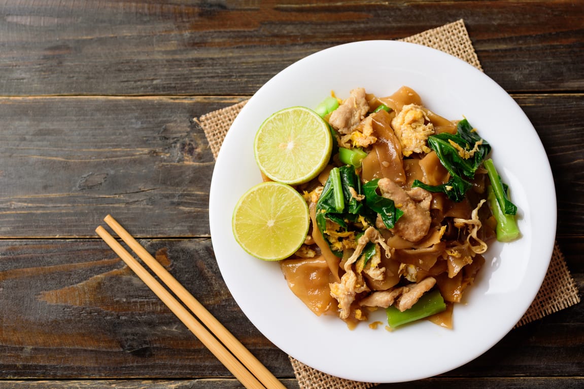 Pad See Ew, wide rice noodles with broccoli and egg